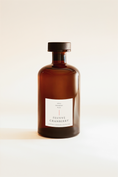 Load image into Gallery viewer, Festive Cranberry diffuser bottle in amber glass with a cream label, shown without its reeds