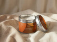 Load image into Gallery viewer, Pumpkin & Chestnut candle tin 211ml open on draped linen, silver lid propped to show the printed lid