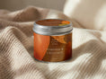 Load image into Gallery viewer, Pumpkin & Chestnut candle tin 211ml with the lid on, resting on ribbed cream fabric