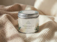 Load image into Gallery viewer, Sage & Sea Salt candle tin 211ml with the lid on, resting on ribbed cream fabric