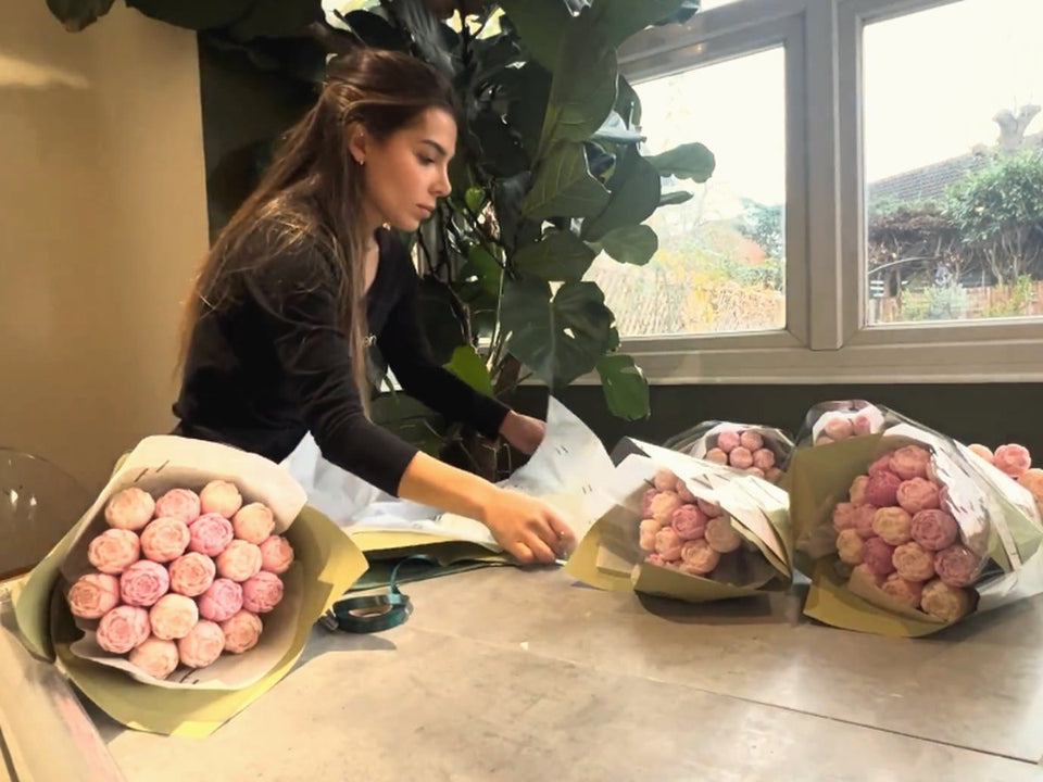 Helia Sinclair wrapping wax melt bouquets by hand in Kent