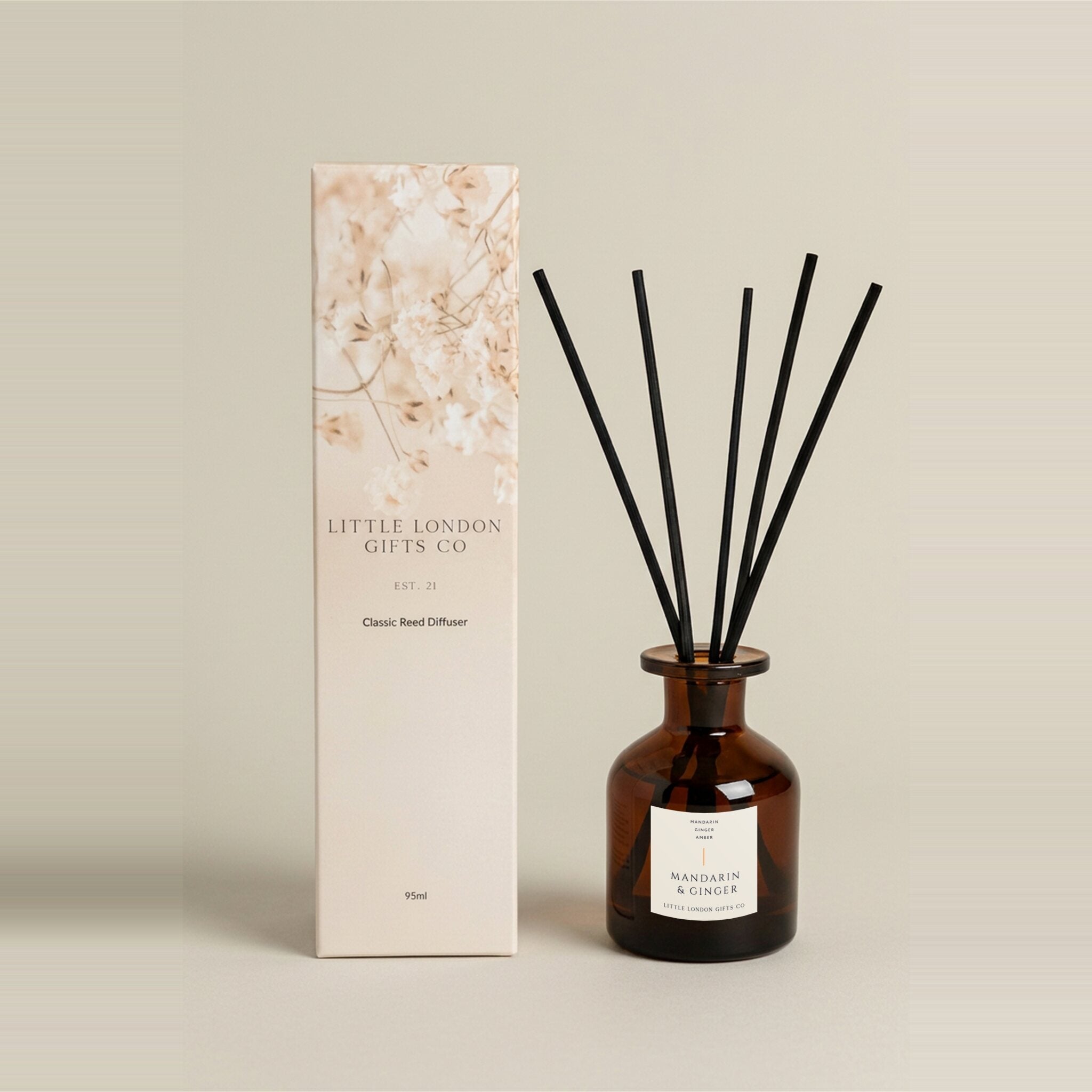 Mandarin & Ginger 95ml reed diffuser, amber glass bottle with black rattan reeds and a blush floral gift box