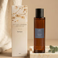 Load image into Gallery viewer, Orchid Noir room spray 100ml with its Little London Gifts Co gift box, styled with linen and eucalyptus
