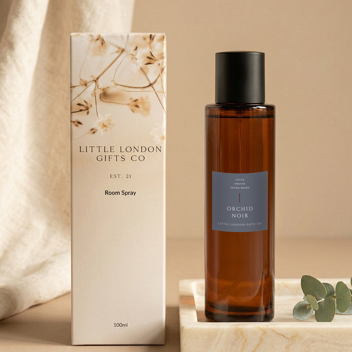 Orchid Noir room spray 100ml with its Little London Gifts Co gift box, styled with linen and eucalyptus