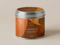 Load image into Gallery viewer, Pumpkin & Chestnut candle tin 211ml in orange and brown with autumn leaf artwork, silver lid on, on a plain warm backdrop
