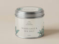 Load image into Gallery viewer, Sage & Sea Salt candle tin 211ml in cream with sage green leaf artwork, silver lid on, on a plain warm backdrop
