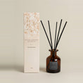 Load image into Gallery viewer, Vintage Dark Honey 95ml reed diffuser, amber bottle with a navy label, black reeds and a cream floral gift box
