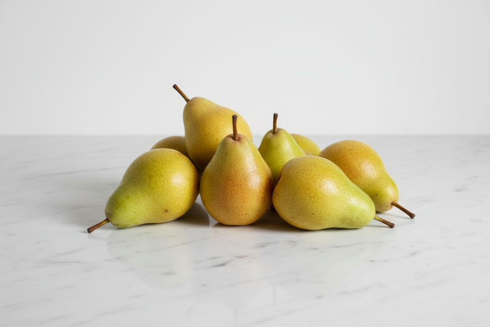 Whole Pears on a white marble worktop